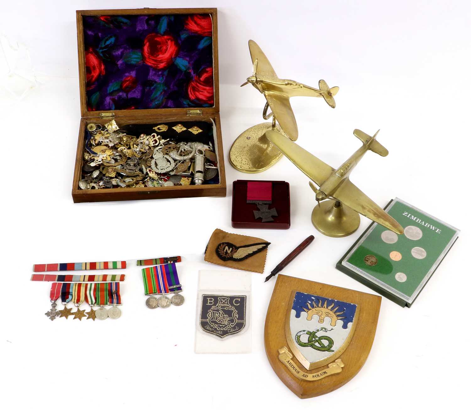 A Small Quantity of Militaria, including two sets of miniature medals, a copy of a Victoria Cross,