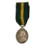 A Territorial Force Efficiency Medal (George V), awarded to 2202 SJT:E.E.PIGG. NTH'LD YEO.