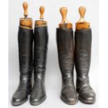 Two Pairs of Black Leather Riding Boots, with wooden treesPair 1 - patched areas to both boots and