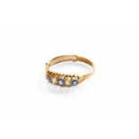 An Early 20th Century 18 Carat Gold Sapphire and Diamond Five Stone Ring, three round cut