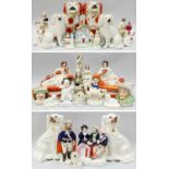 A Collection of Victorian Staffordshire Pottery, including a pair of spaniels carrying baskets of