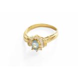 An Aquamarine and Diamond Cluster Ring, stamped '750' and '18K', finger size NGross weight 3.8