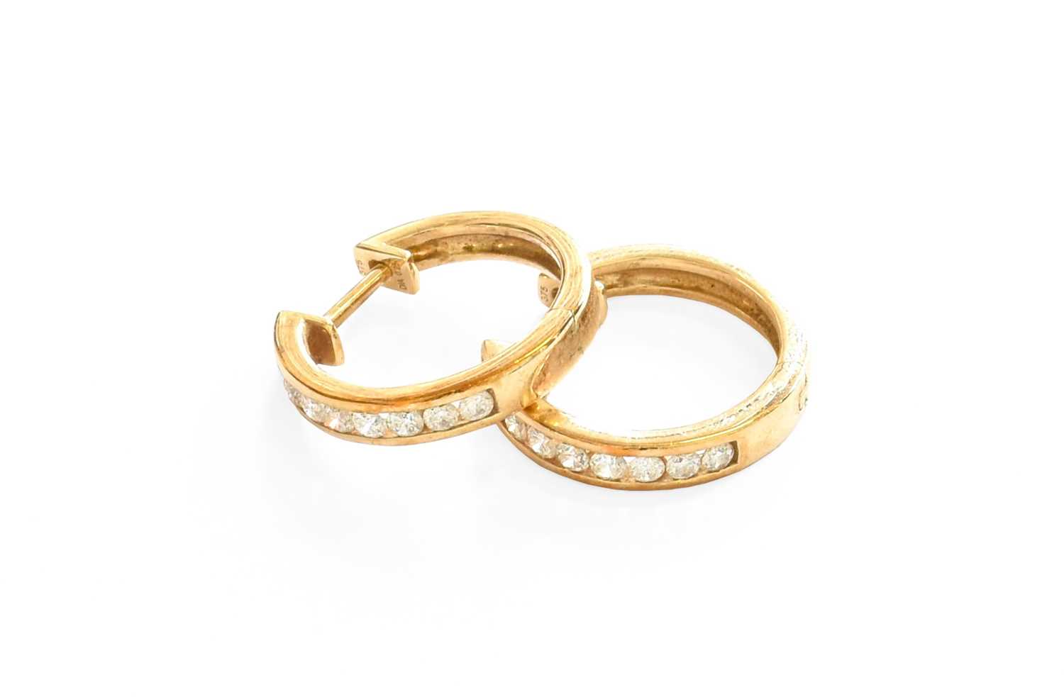 A Pair of Diamond Hoop Earrings, stamped '375', with post fittingsGross weight 4.0 grams.
