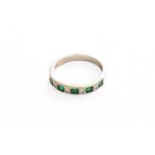 An Emerald and Diamond Half Hoop Ring, stamped '18CT' and '750', finger size P1/2Gross weight 4.4