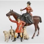 A Cold Painted Metal Figure Group as a Hunting Party, and an individual hound
