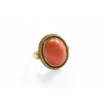 A Coral Ring, stamped '585', finger size K1/2Gross weight 6.7 grams.