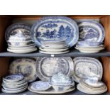 A Collection of Blue and White Willow Pattern Meat Plates, tureens, sauce boats and other dinner