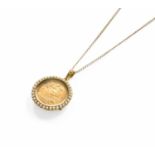 A Half Sovereign Pendant on Chain, dated 1914, enclosed within a split pearl locket, stamped '15CT',