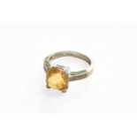 An 18 Carat White Gold Citrine and Diamond Ring, finger size PGross weight 5.4 grams.
