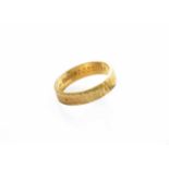 An 18 Carat Gold Textured Band Ring, finger size LGross weight 3.5 grams.