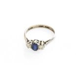 A Sapphire and Diamond Three Stone Ring, stamped '18CT' and 'PLAT', finger size JThe ring is in fair