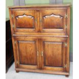 A Titchmarsh & Goodwin Style Oak Cupboard, with four moulded cupboard doors and a dressing slide,