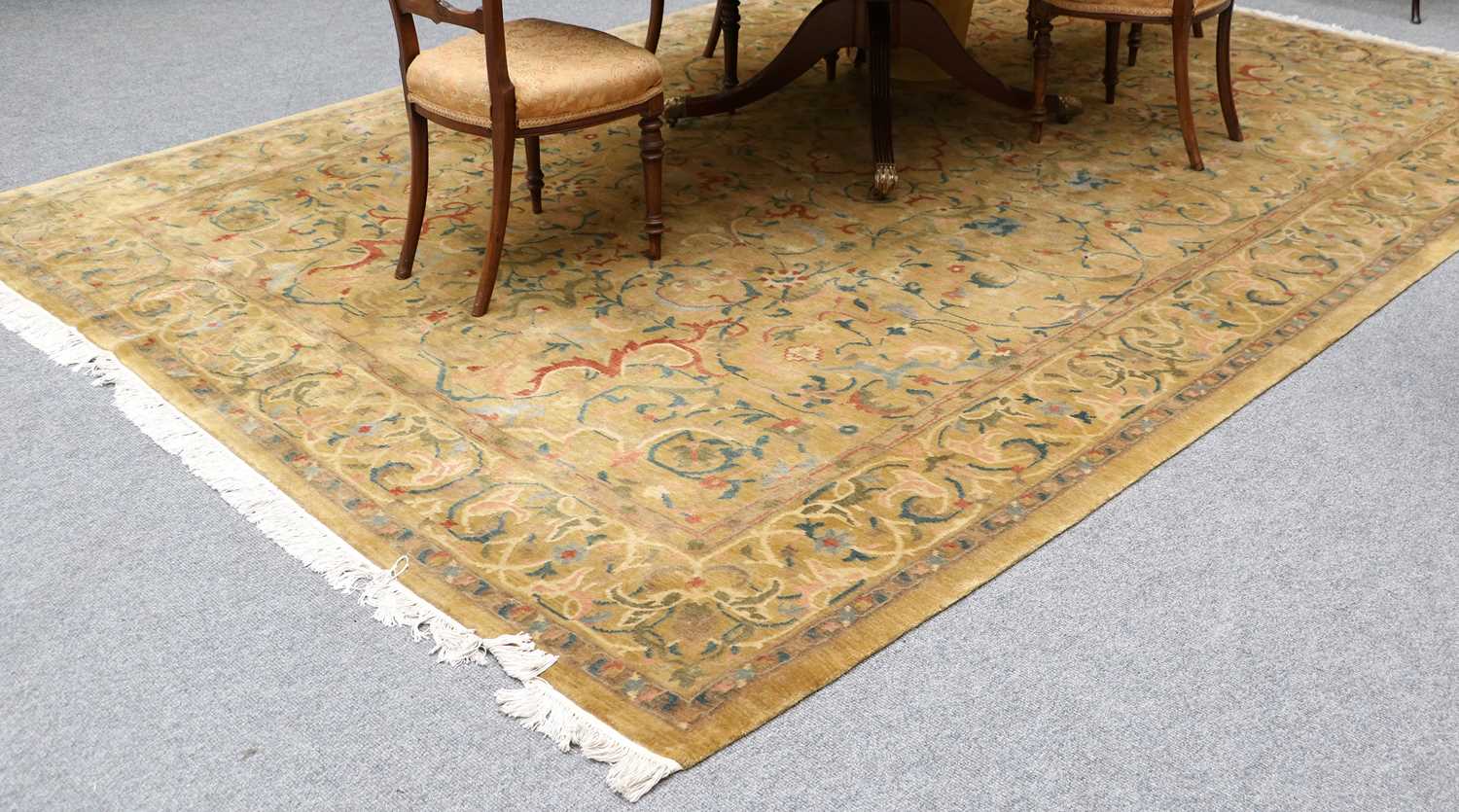 A Ziegler Design Rug, the mustard field with trailing vines and narrow conforming borders, 373cm