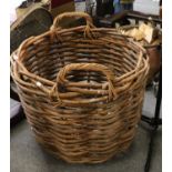 A substantial wicker log basket, 75cm dia.