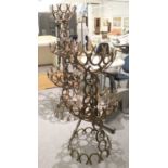 Farrier art. A three tier garden planter composed of horseshoes, together with a two tier example,