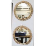 A Pair of Circular Gilt Framed Mirrors, each 67cm diameter