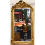 A Rococo Style Gilt Framed Mirror, surmounted by scrolling acanthis leaves and with beveled plate,