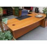 Neudorfler: A Cherrywood Corner Desk, in three sections, with inset leather writing surface,