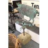 A Copper Weather Vane, in the form of a pig, mounted on a square sandstone plinth, 118cm