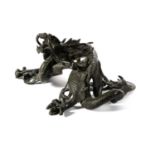 A Chinese Bronze Figure of a Dragon, 19th century, the five-toed beast crouching with head