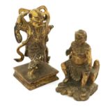 A Chinese Carved, Gilt and Painted Wood Figure of a Deity, in Ming style, the seated figure with