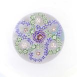 A Baccarat Garlanded Paperweight, circa 1850, the central canes within blue and green trefoil