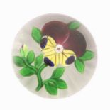 A Baccarat Pansy Paperweight, circa 1850, with single bud, star cut base7.5cm diameterNo