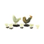 A Chinese Jade Family of Hens, the naturalistically carved birds comprising a cockerel, hen and five