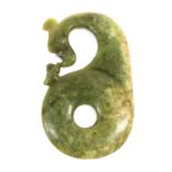 A Chinese Jade Carving, in Archaic style, as a Bi disk surmounted by a dragon's head and