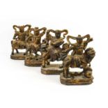 A Matched Set of Four Chinese Carved, Gilt and Painted Wood Figures of Warriors, in Ming style, each