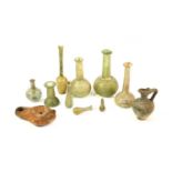 A Collection of Nine Various Roman Glass Unguentariums, probably 1st/2nd century ADthe largest