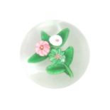 A Clichy Miniature Paperweight With Spray of Flowers, circa 1850, worked with three flowers on a