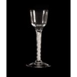 A Wine Glass, circa 1750, the ogee bowl on a triple series opaque twist stemBubble inclusions and