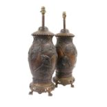 A Pair of Japanese Bronzed Terracotta Table Lamps, Meiji period, of baluster form, cast in relief