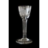 A Wine Glass of Jacobite Significance, circa 1750, the ovoid bowl engraved with a rose spray, the