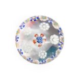 A St Louis Miniature Millefiori Paperweight, circa 1850, with a central blue, red and white florette