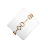 A Fancy Link Bracelet designed as yellow chain linked snaffle bit motifslength 19.8cmThe bracelet is