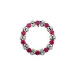 A Synthetic Ruby and Diamond Pendantthe circular frame comprising of round cut synthetic rubies,