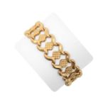 A Fancy Link Bracelet the yellow textured square plaques flanked by rows of plain polished s-