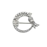 A Diamond Broochthe ribbon tied circular frame set throughout with round brilliant cut, eight-cut