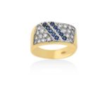 A Sapphire and Diamond Ringtwo rows of round cut sapphires aligned diagonally, in white claw and