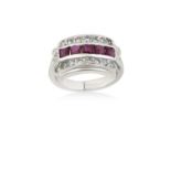 A Ruby and Diamond Ringfive calibré cut rubies in white channel settings, within a border of eight-
