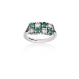 An 18 Carat White Gold Emerald and Diamond Two Row Ringthe round cut emeralds alternate with round