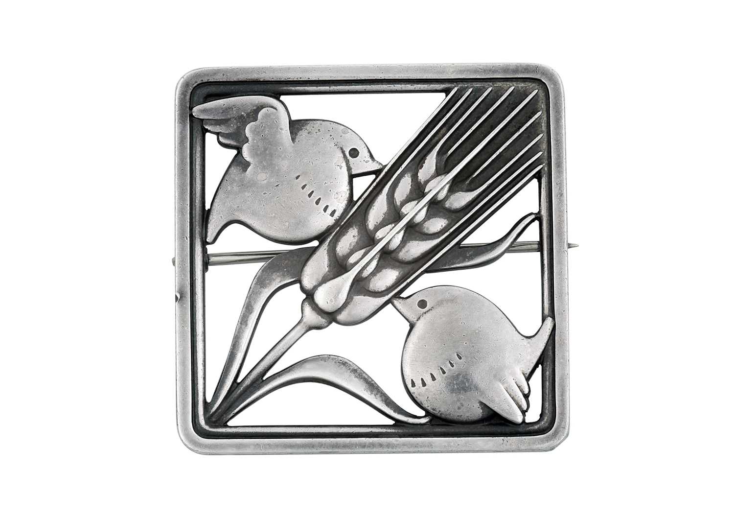 A Silver Brooch, by Georg Jensenthe square frame with a wheatsheaf diagonally and a bird in each