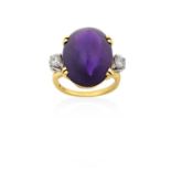 An Amethyst and Diamond Three Stone Ringthe oval sugarloaf cabochon amethyst in a yellow claw