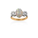 An Opal and Diamond Three Stone Ringthe oval cabochon opal in a white claw setting, flanked by two