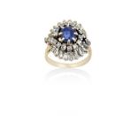 A Sapphire and Diamond Cluster Ring the oval cut sapphire within a radiating border of eight-cut and
