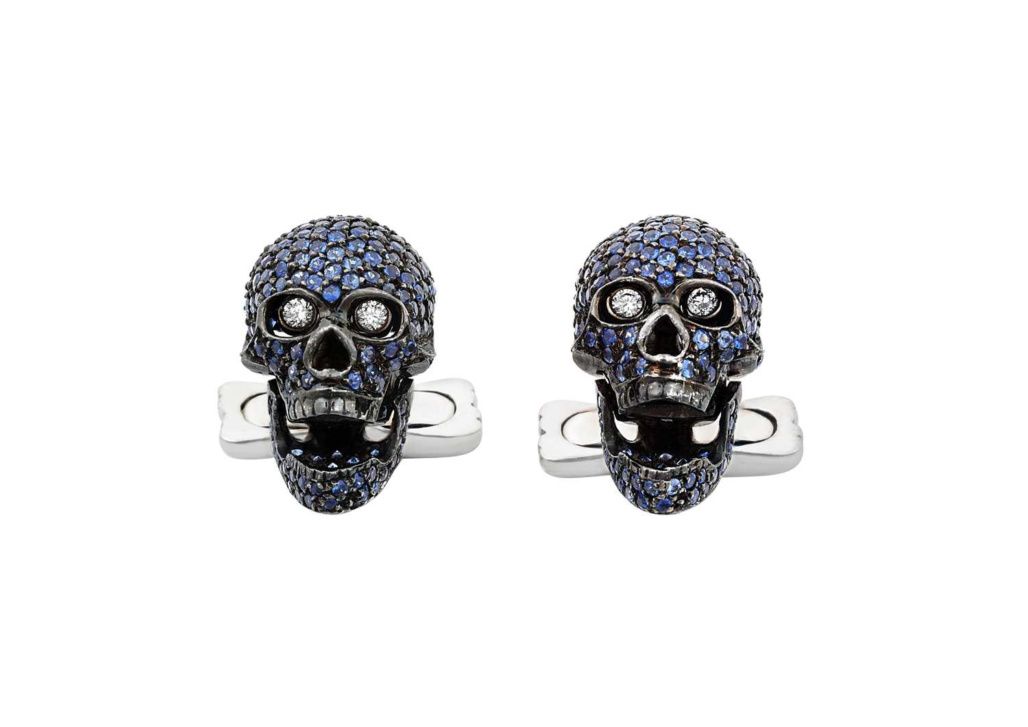 A Pair of 18 Carat Gold Blue Stone and Diamond Skull Cufflinksthe skull motif pavé set throughout