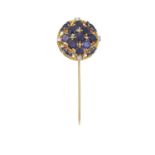 A Sapphire and Diamond Stickpin the central cluster formed of nine round cut sapphires spaced by