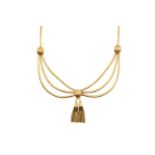 A Fancy Link Necklace three rows of yellow brick links gathered centrally to a tassel drop, to a